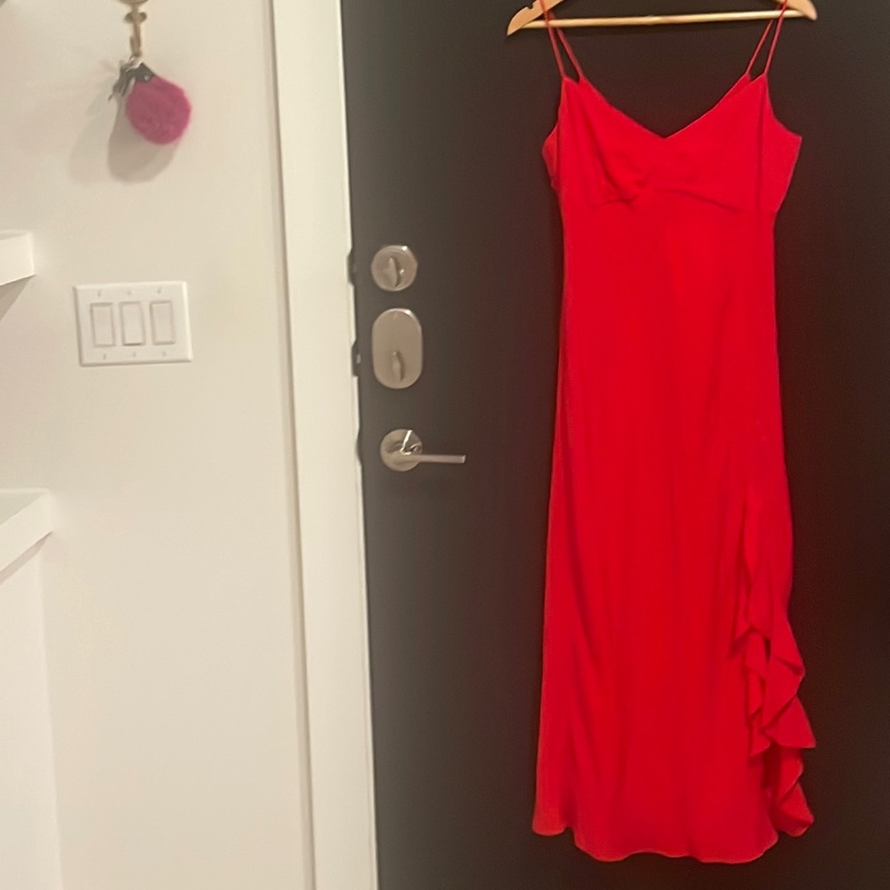 red zara dress with side leg slit and slight polka dot pattern